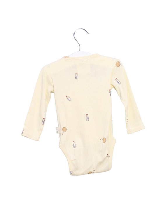 A Ivory Bodysuits from Konges Sløjd in size 3-6M for neutral. (Back View)