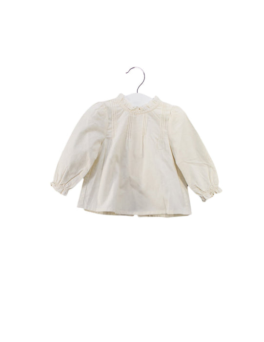 A Ivory Long Sleeve Tops from Louisiella in size 6-12M for girl. (Front View)