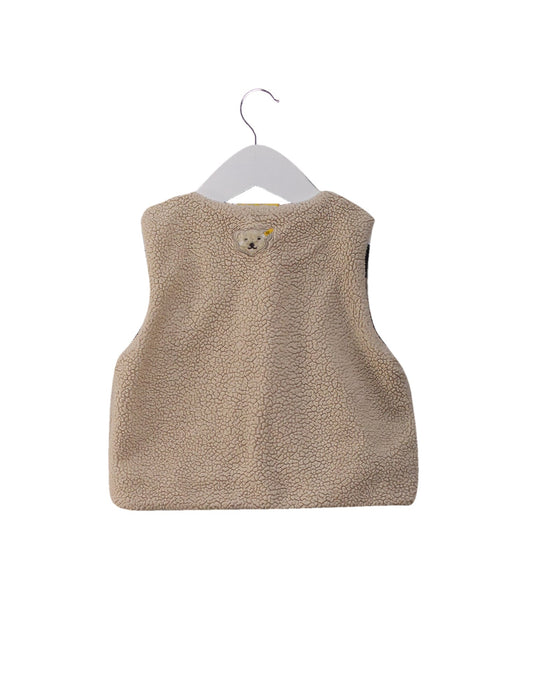 A Beige Outerwear Vests from Steiff in size 6-12M for girl. (Back View)