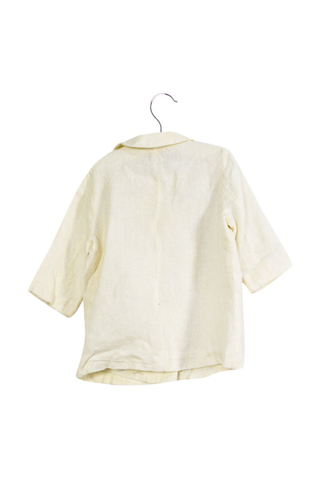 A White Coats from Simonetta in size 12-18M for girl. (Back View)