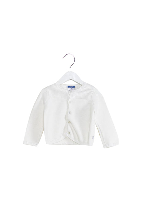 A White Cardigans from Jacadi in size 6-12M for girl. (Front View)