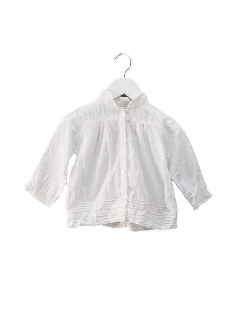 A White Shirts from DPAM in size 6-12M for girl. (Front View)