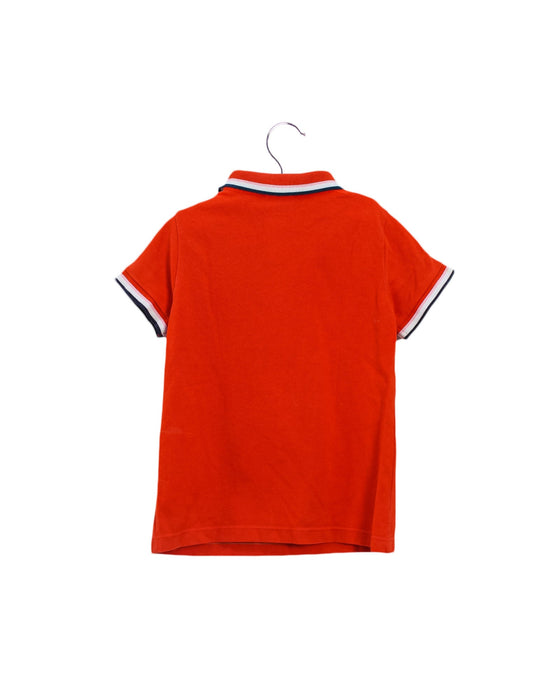 A Orange Short Sleeve Polos from Jacadi in size 4T for boy. (Back View)