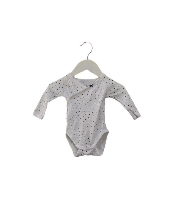 A Navy Long Sleeve Bodysuits from Petit Bateau in size 0-3M for girl. (Front View)