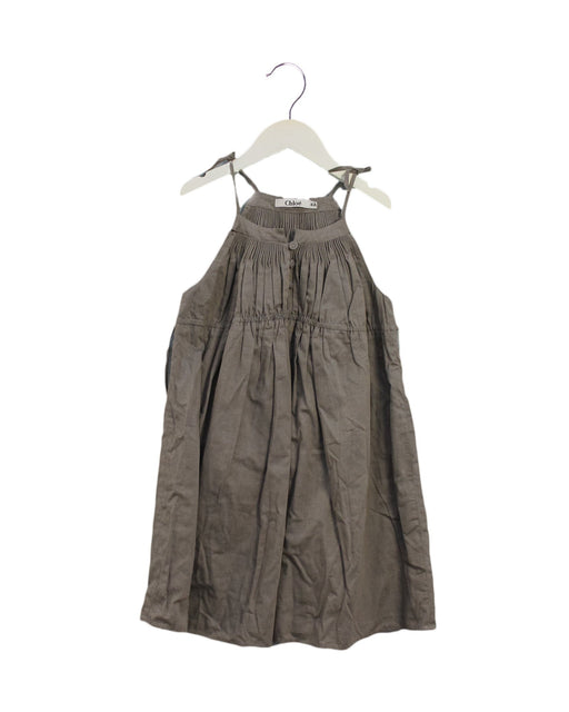 A Brown Sleeveless Dresses from Chloe in size 6T for girl. (Front View)