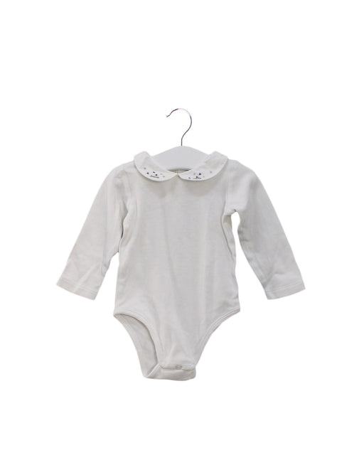 A White Long Sleeve Bodysuits from Jacadi in size 6-12M for girl. (Front View)