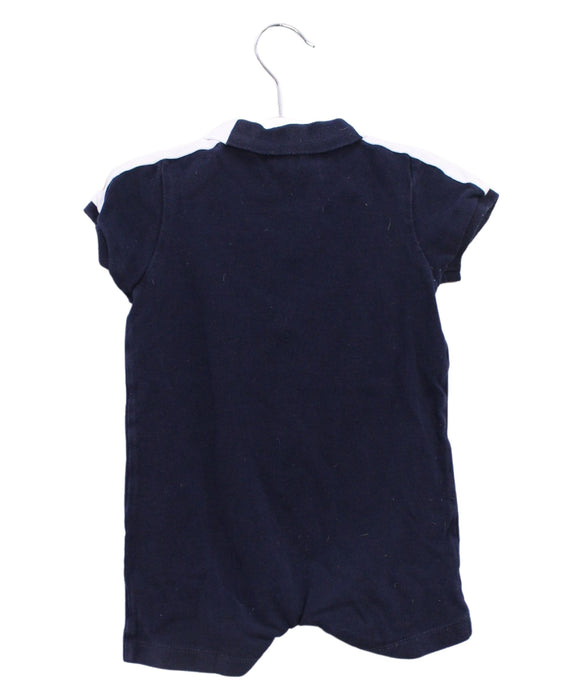 A Navy Short Sleeve Rompers from Jacadi in size 12-18M for boy. (Back View)