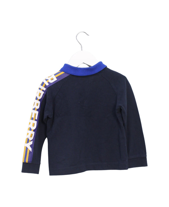 A Navy Long Sleeve Polos from Burberry in size 2T for boy. (Back View)