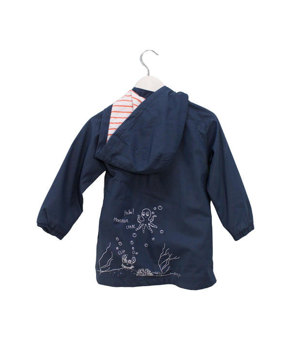 A Blue Rain Jackets from La Compagnie des Petits in size 4T for girl. (Back View)