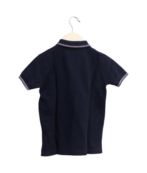 A Navy Short Sleeve Polos from Petit Bateau in size 5T for boy. (Back View)