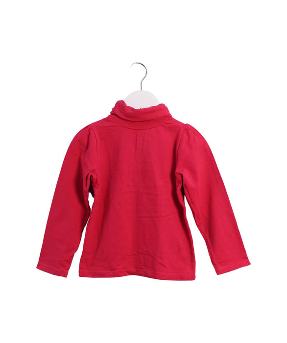 A Pink Long Sleeve Tops from Jacadi in size 4T for girl. (Front View)