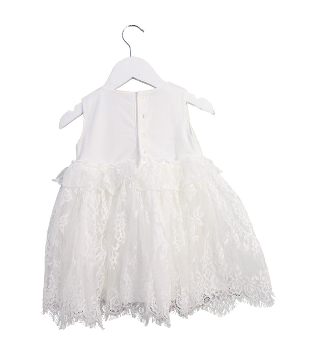 A White Sleeveless Dresses from Miniclasix in size 6-12M for girl. (Back View)