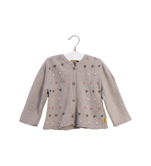 A Taupe Cardigans from Steiff in size 6-12M for girl. (Front View)