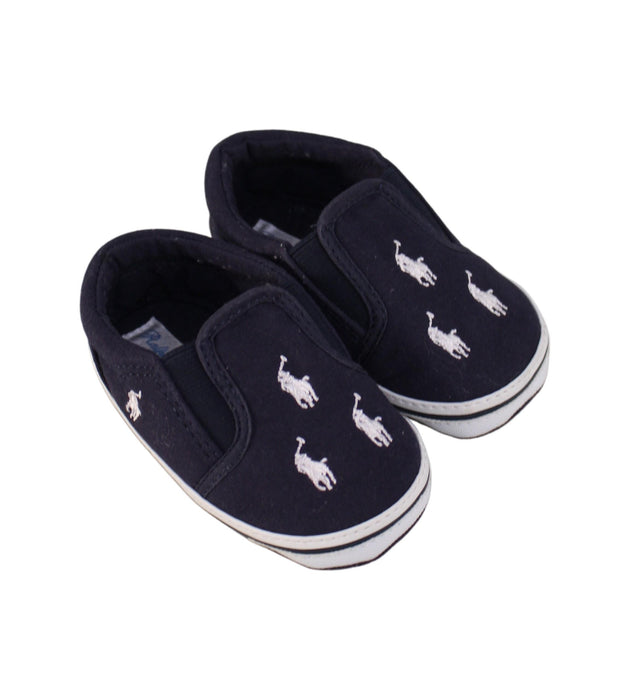 A Navy Slip Ons from Ralph Lauren in size 12-18M for neutral. (Front View)
