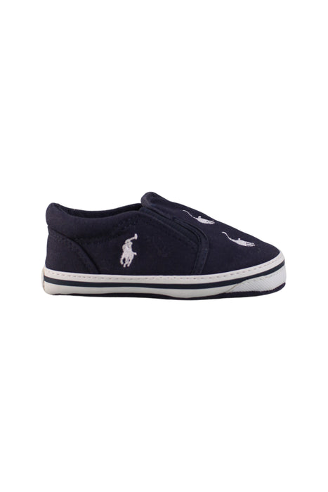 A Navy Slip Ons from Ralph Lauren in size 12-18M for neutral. (Back View)
