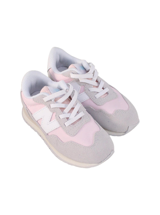 A Pink Sneakers from New Balance in size 4T for girl. (Front View)