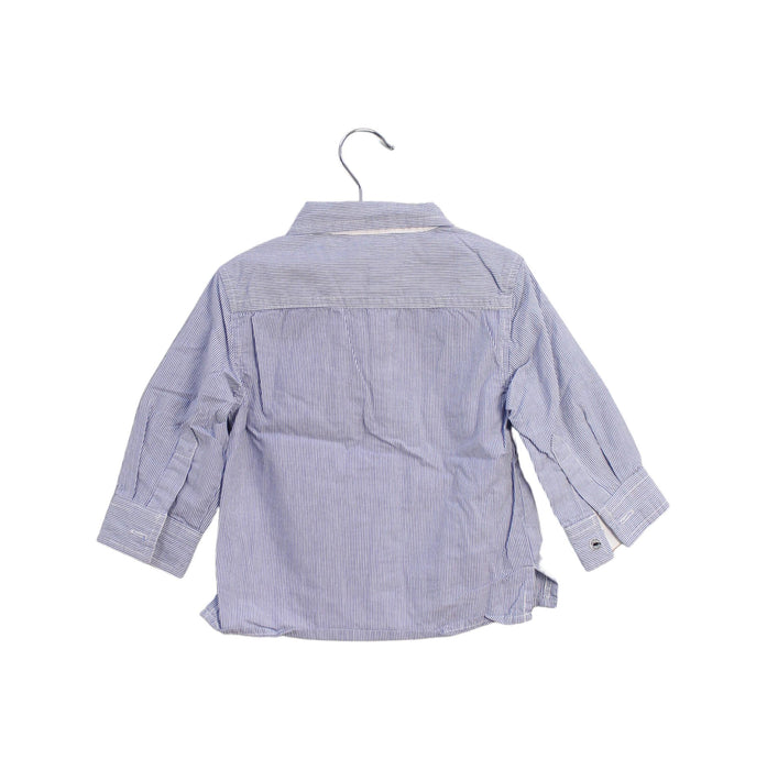 A Blue Shirts from Noukie's in size 6-12M for boy. (Back View)