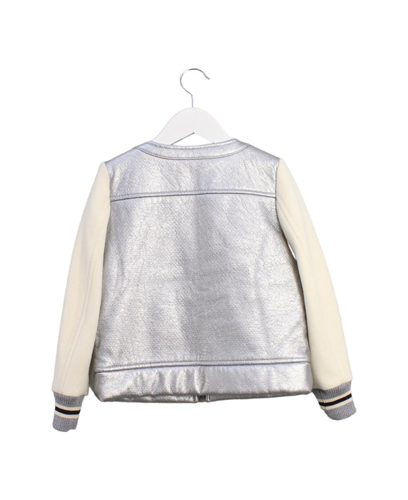 A Silver Lightweight Jackets from Simonetta in size 6T for girl. (Back View)