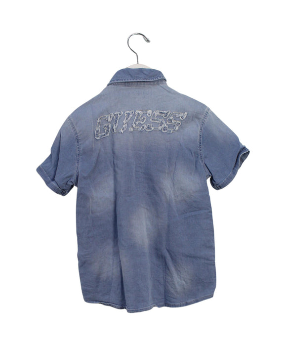 A Blue Shirts from Guess in size 6T for boy. (Back View)