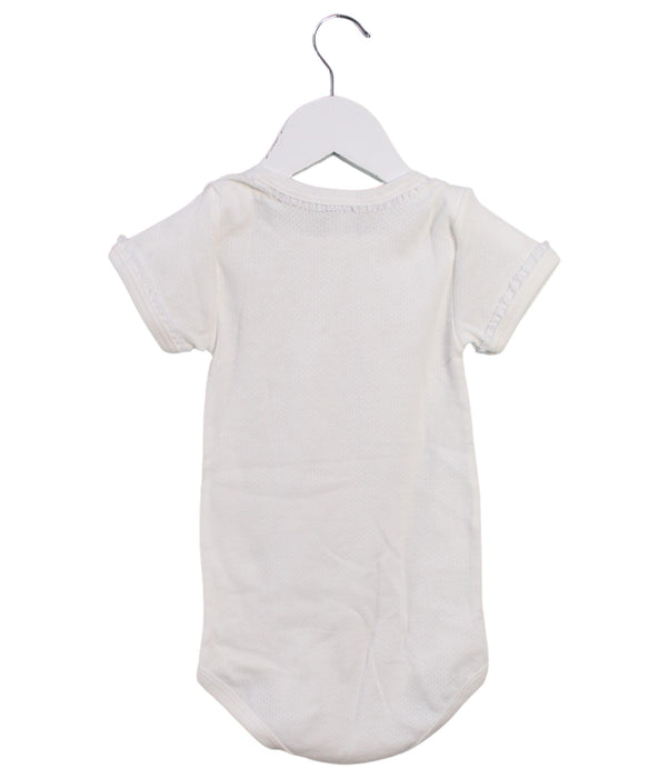 A White Short Sleeve Bodysuits from Petit Bateau in size 3T for girl. (Back View)