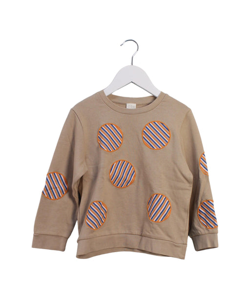 A Beige Crewneck Sweatshirts from COS in size 4T for girl. (Front View)