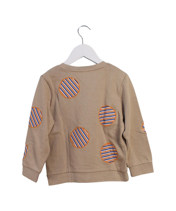 A Beige Crewneck Sweatshirts from COS in size 4T for girl. (Back View)