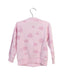 A Pink Lightweight Jackets from Chicco in size 2T for girl. (Back View)