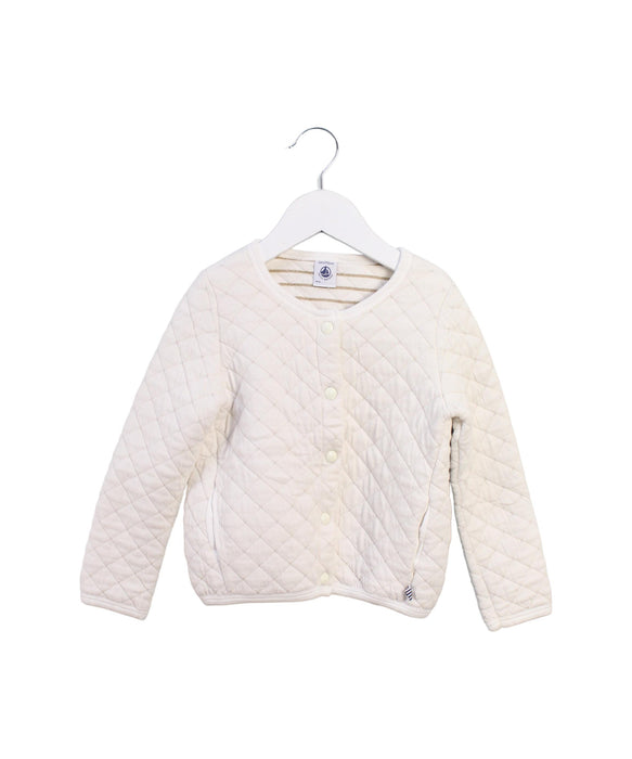 A White Puffer/Quilted Jackets from Petit Bateau in size 4T for girl. (Front View)