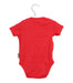 A Red Short Sleeve Bodysuits from Frugi in size 0-3M for girl. (Back View)