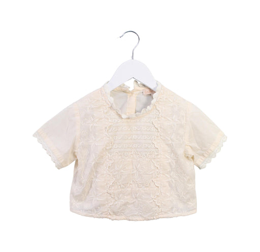A Beige Short Sleeve Tops from Louise Misha in size 4T for girl. (Front View)