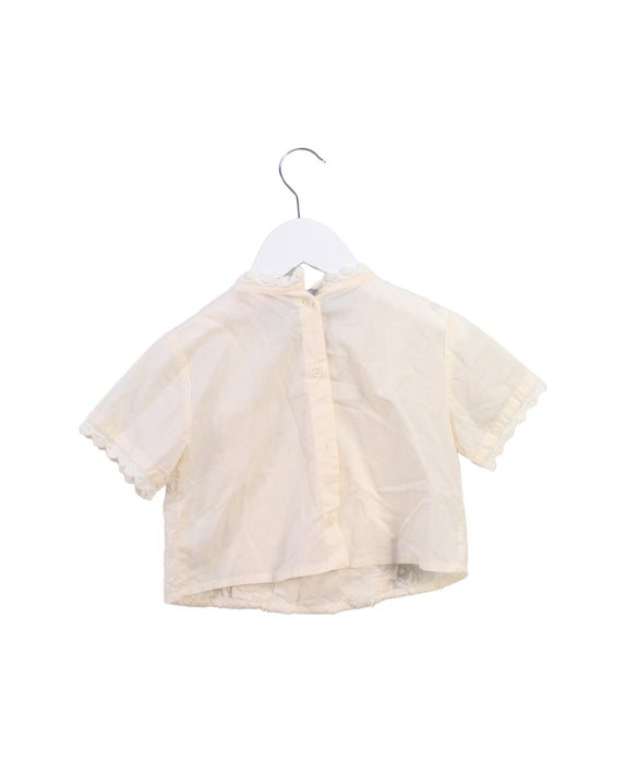 A Beige Short Sleeve Tops from Louise Misha in size 4T for girl. (Back View)