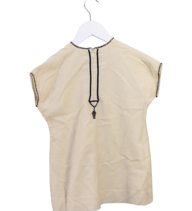 A Beige Short Sleeve Dresses from Caramel in size 4T for girl. (Back View)