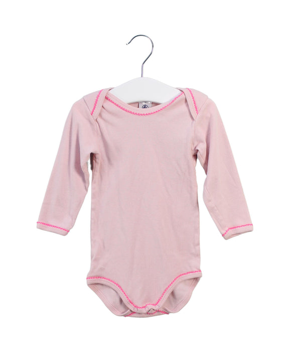 A Pink Long Sleeve Bodysuits from Petit Bateau in size 6-12M for girl. (Front View)