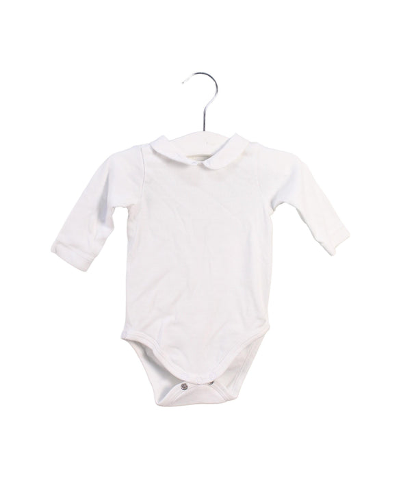 A White Long Sleeve Bodysuits from Jacadi in size 0-3M for girl. (Front View)