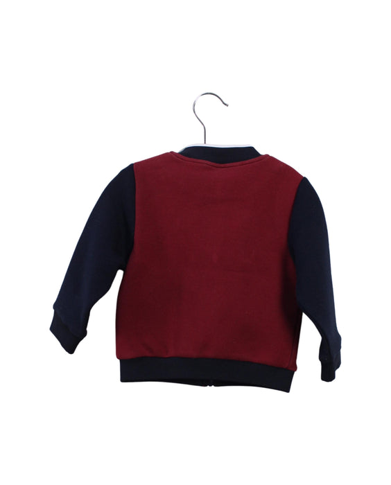 A Red Lightweight Jackets from Jacadi in size 12-18M for boy. (Back View)