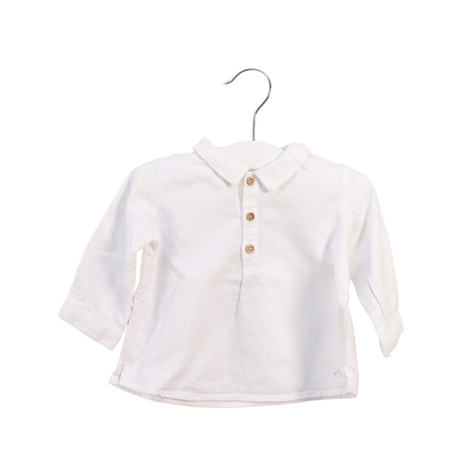 A White Long Sleeve Tops from Nanos in size 3-6M for girl. (Front View)
