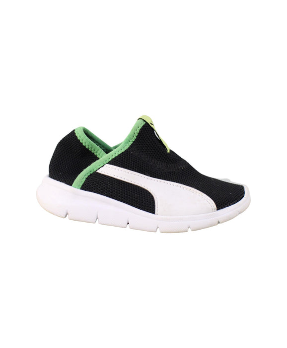 A Black Slip Ons from Puma in size 4T for girl. (Back View)