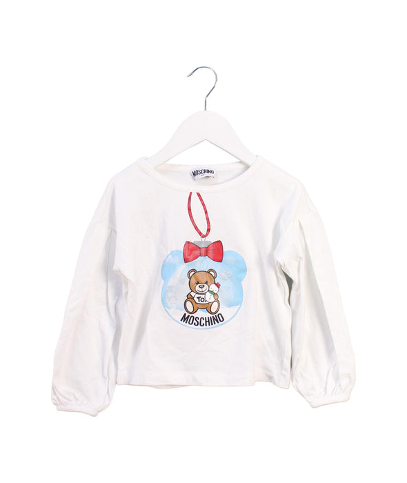 A White Long Sleeve Tops from Moschino in size 4T for girl. (Front View)