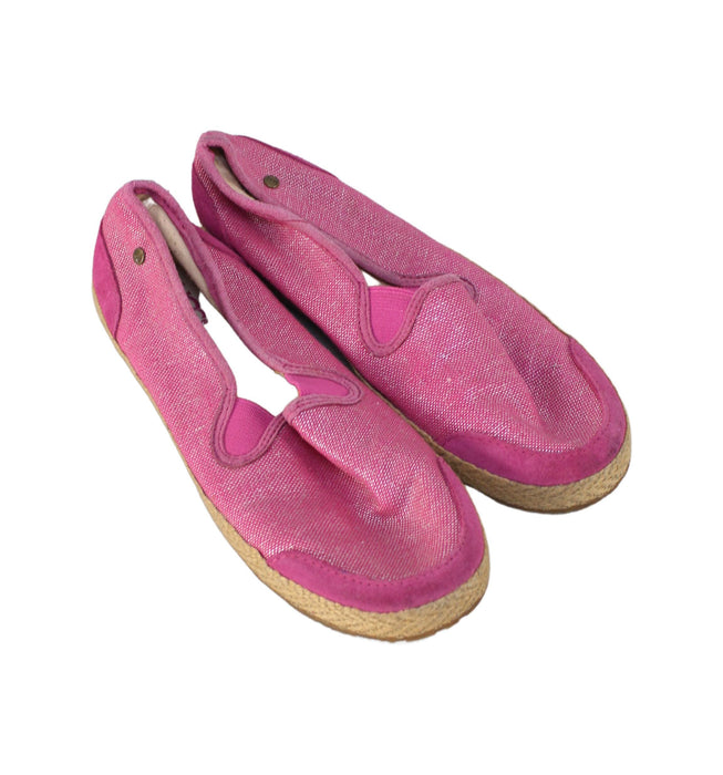 A Pink Slip Ons from UGG in size 7Y for girl. (Front View)