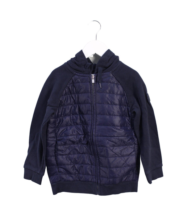 A Blue Lightweight Jackets from Jacadi in size 6T for boy. (Front View)