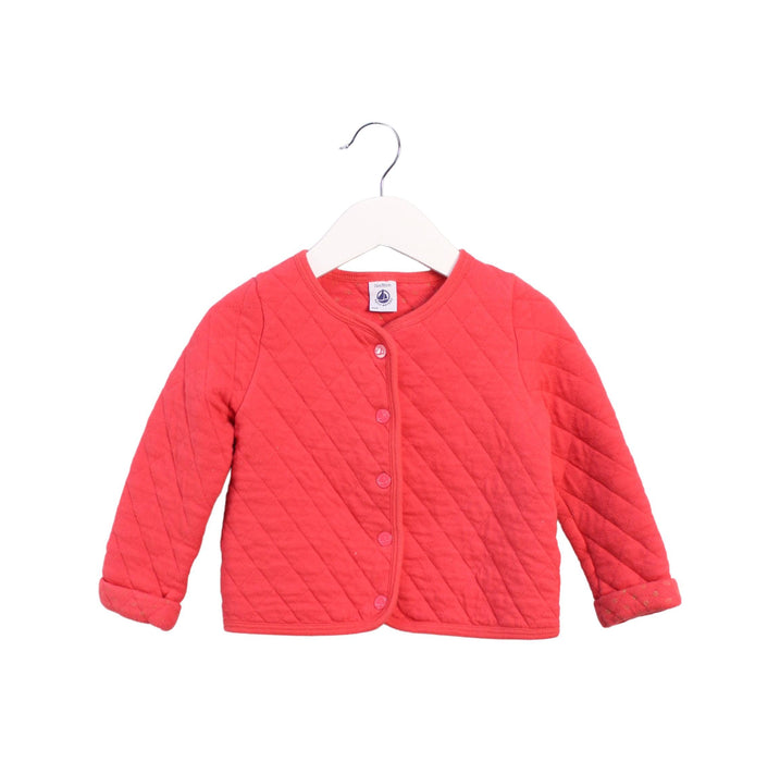 A Red Cardigans from Petit Bateau in size 2T for girl. (Front View)