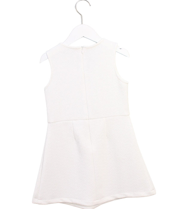 A White Sleeveless Dresses from Gingersnaps in size 8Y for girl. (Back View)