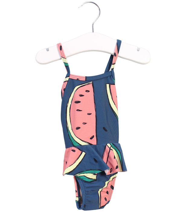 A Green Swimsuits from Tea in size 3-6M for girl. (Front View)