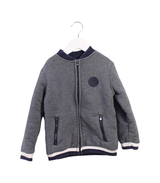 A Grey Lightweight Jackets from Jacadi in size 6T for boy. (Front View)