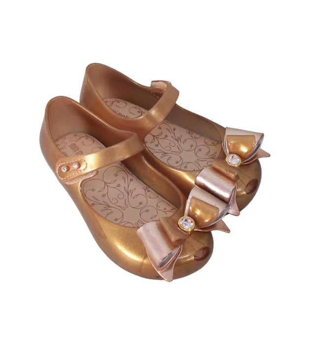 A Gold Flats from Mini Melissa in size 4T for girl. (Front View)