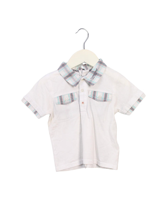 A White Short Sleeve Polos from Timberland in size 12-18M for boy. (Front View)