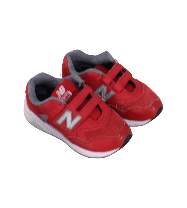 A Red Sneakers from New Balance in size 6T for boy. (Front View)