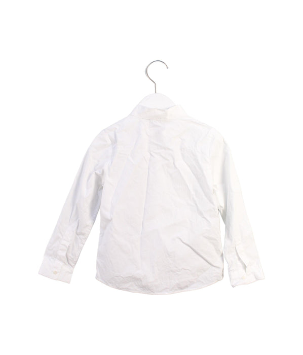 A White Shirts from Dior in size 5T for girl. (Back View)