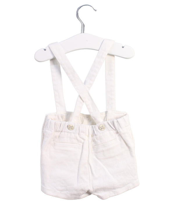 A White Overall Shorts from Nanos in size 6-12M for girl. (Back View)