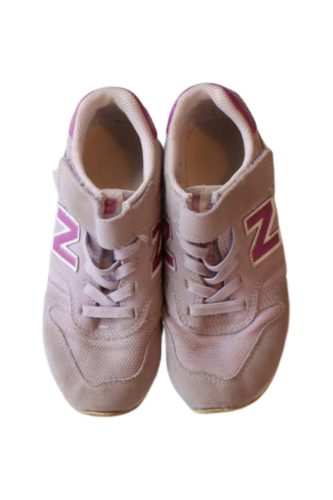 A Purple Sneakers from New Balance in size 6T for girl. (Back View)